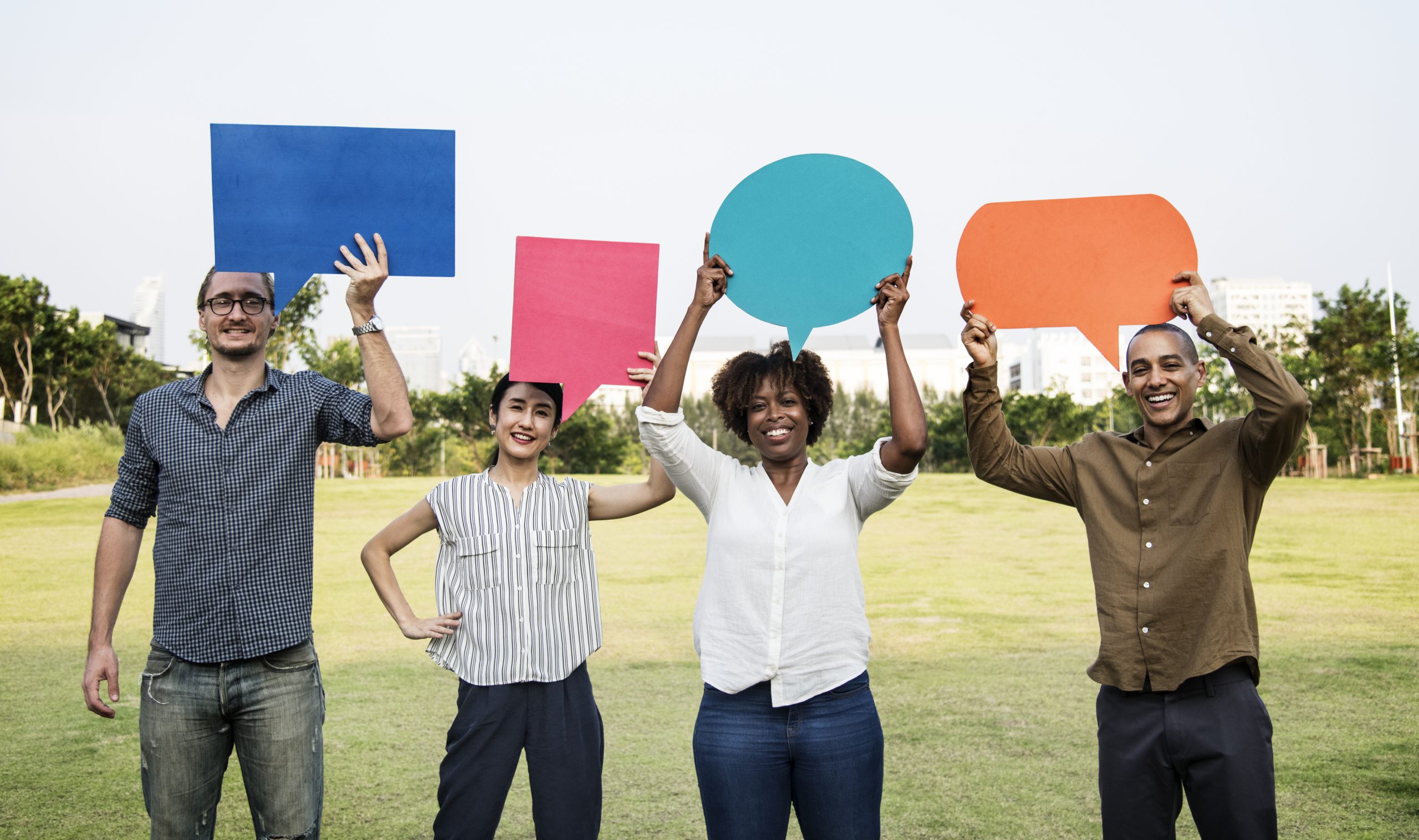 Diverse friends holding speech bubbles several people holding question bubbles above their heads